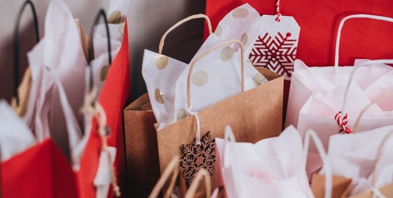 Holiday Shopping - shallow focus photography of paper bags