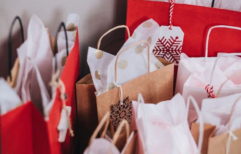 Holiday Shopping - shallow focus photography of paper bags