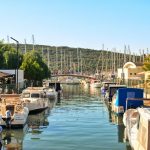 Seasonal Sales - white and blue boat on dock during daytime