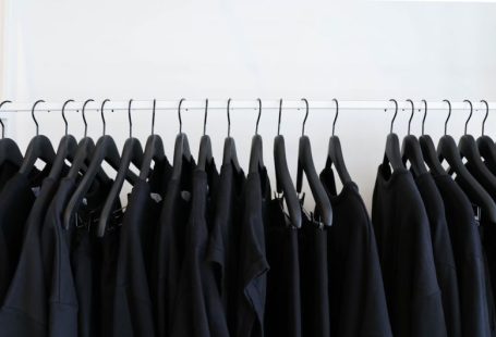 Clothing Shopping - black clothes hanged in rack