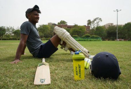 Sports Recreation - man in gray t-shirt and black cap holding white plastic bottle