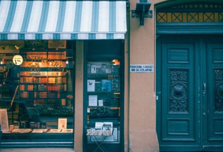 Book Sale - Bookstore building facade on pavement in city