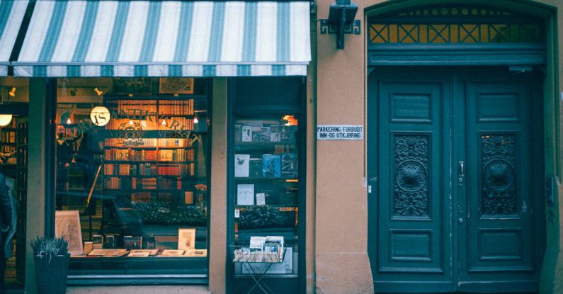 Book Sale - Bookstore building facade on pavement in city