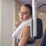 Shopping Club - Happy young sportswoman in modern sports club