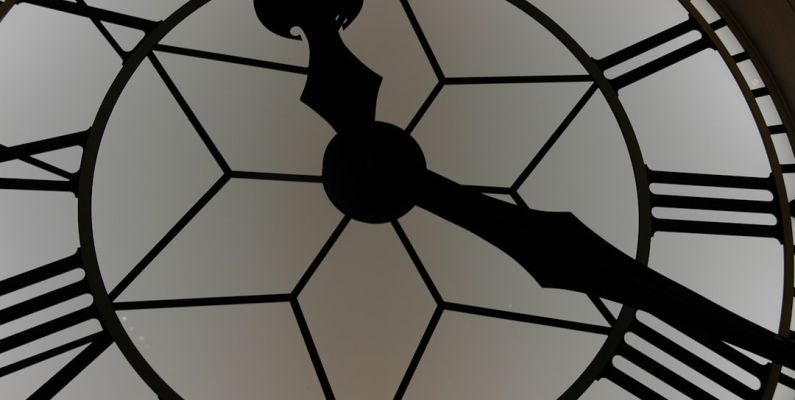 Coupon Timing - close-up photography of white and black clock
