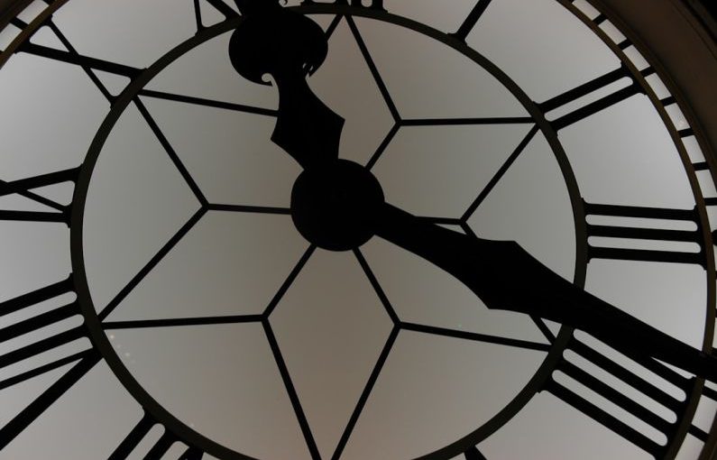 Coupon Timing - close-up photography of white and black clock