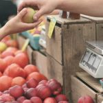 Farmers Market - Person Giving Fruit to Another