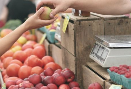 Farmers Market - Person Giving Fruit to Another