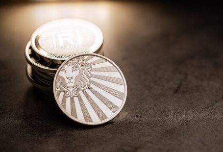 Coupons Stacking - a stack of coins sitting on top of a table