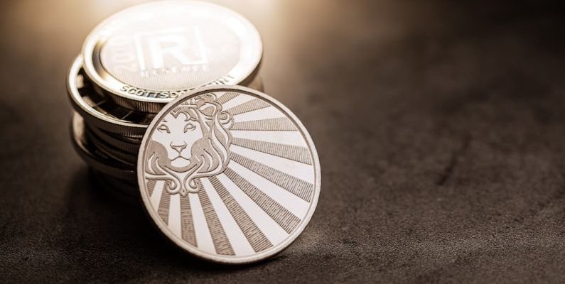 Coupons Stacking - a stack of coins sitting on top of a table