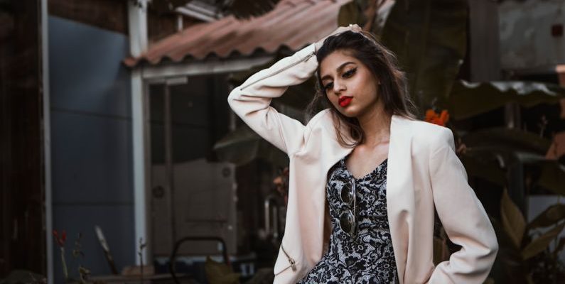 Free Product - woman in white blazer standing and smiling