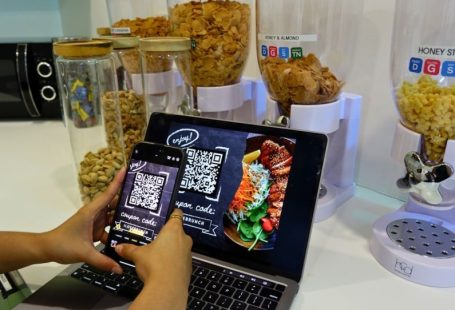 Restaurant Coupon - a person using a cell phone and a laptop on a table