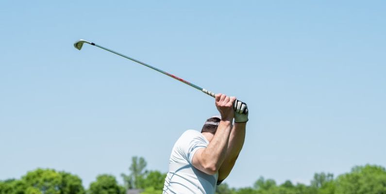 Wholesale Club - man in white tank top and white shorts playing golf during daytime