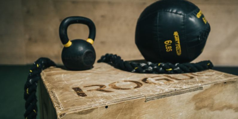 Membership Benefit - black metal kettle bell and heavy bag