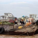 Home Goods Wholesale - a group of people sitting on top of a wooden boat