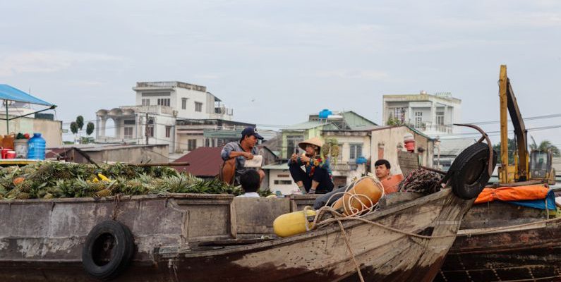 Home Goods Wholesale - a group of people sitting on top of a wooden boat