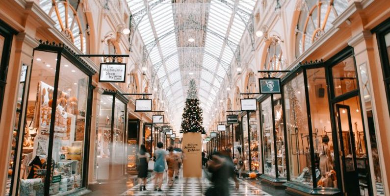 Holiday Shopping - person walking inside building near glass