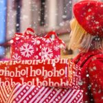 Off-season Shopping - Woman Holding Three Red Christmas Presents Boxes