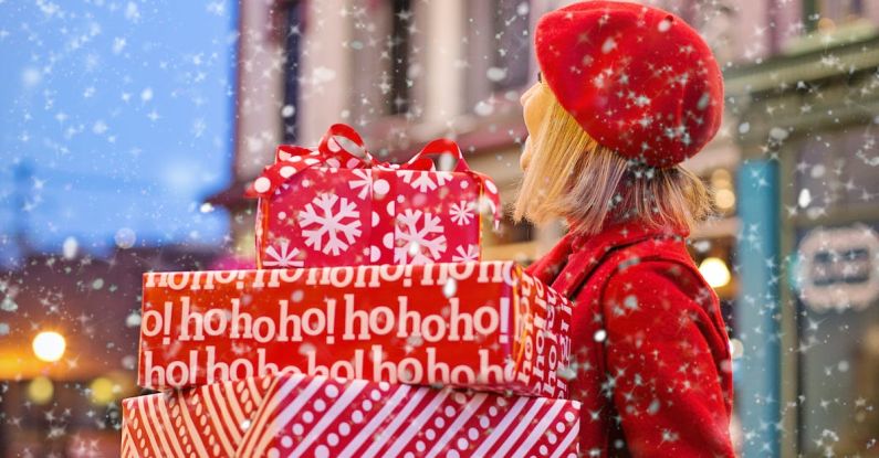 Off-season Shopping - Woman Holding Three Red Christmas Presents Boxes