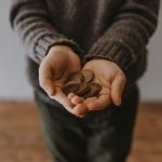 Leftovers Saving - copper-colored coins on in person's hands