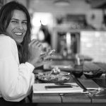 Seasonal Eating - woman in white long sleeve shirt smiling