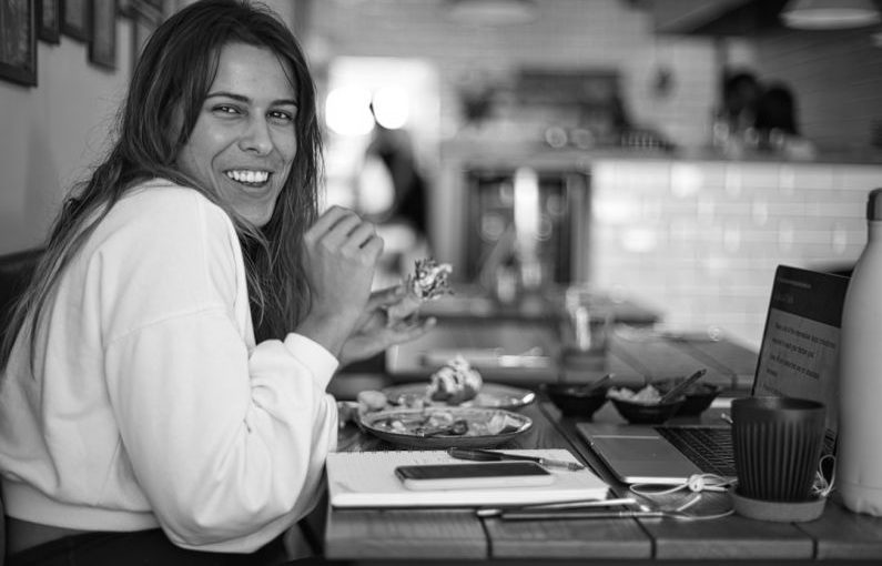 Seasonal Eating - woman in white long sleeve shirt smiling