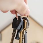 Estate Sale - Person with keys for real estate