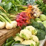 Farmer's Market - green and red vegetable on brown wooden table