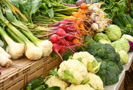 Farmer's Market - green and red vegetable on brown wooden table